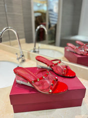 ROCKSTUD MULE SANDALS IN CHERRY RED CALFSKIN AND TRANSPARENT PVC FILM