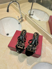ROCKSTUD MULE SANDALS IN BLACK CALFSKIN AND TRANSPARENT PVC FILM