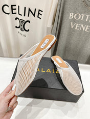 ALAIA FLAT MULES IN WHITE MESH FISHNET