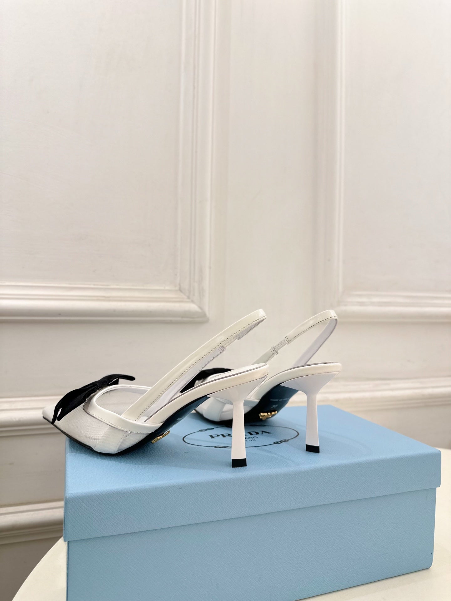 PRADA 26S POINTED-TOE SLINGBACK HEELS 75MM IN WHITE MESH WITH BLACK BOW