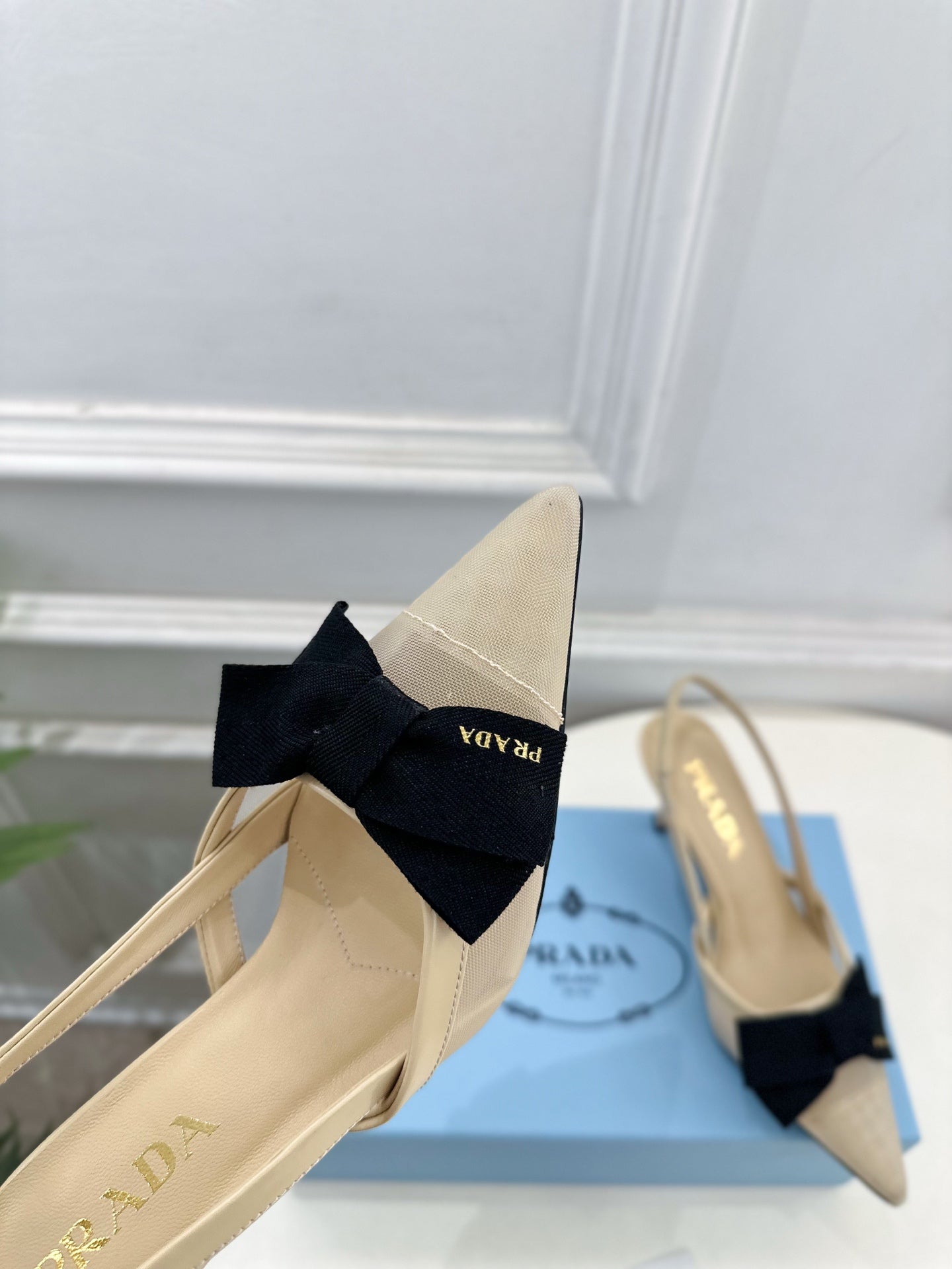 PRADA 26S POINTED-TOE SLINGBACK HEELS 75MM IN BEIGE MESH WITH BLACK BOW