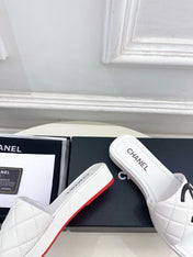 CHANEL 26S FLAT SLIDES IN WHITE LAMBSKIN WITH BLACK CC LOGO