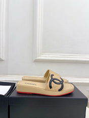 CHANEL 26S FLAT SLIDES IN BEIGE LAMBSKIN WITH BLACK CC LOGO