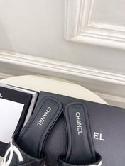 CHANEL 26S FLAT SLIDES IN BLACK LAMBSKIN WITH WHITE CC LOGO
