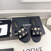 CHANEL 26S FLAT SANDALS IN BLACK LAMBSKIN CHARM-DECORATED