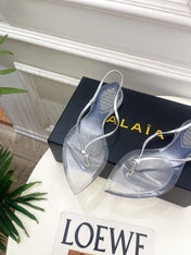 ALAIA 26S POINTED-TOE THONG SANDALS IN SILVER AND TRANSPARENT PVC