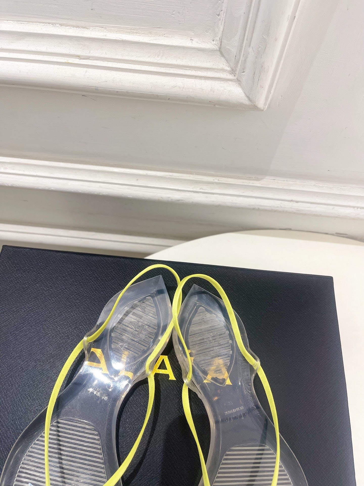 ALAIA 26S POINTED-TOE THONG SANDALS IN LIGHT YELLOW SATIN AND TRANSPARENT PVC
