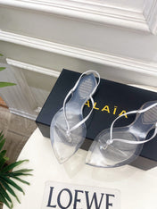 ALAIA 26S POINTED-TOE THONG SANDALS IN WHITE SATIN AND TRANSPARENT PVC