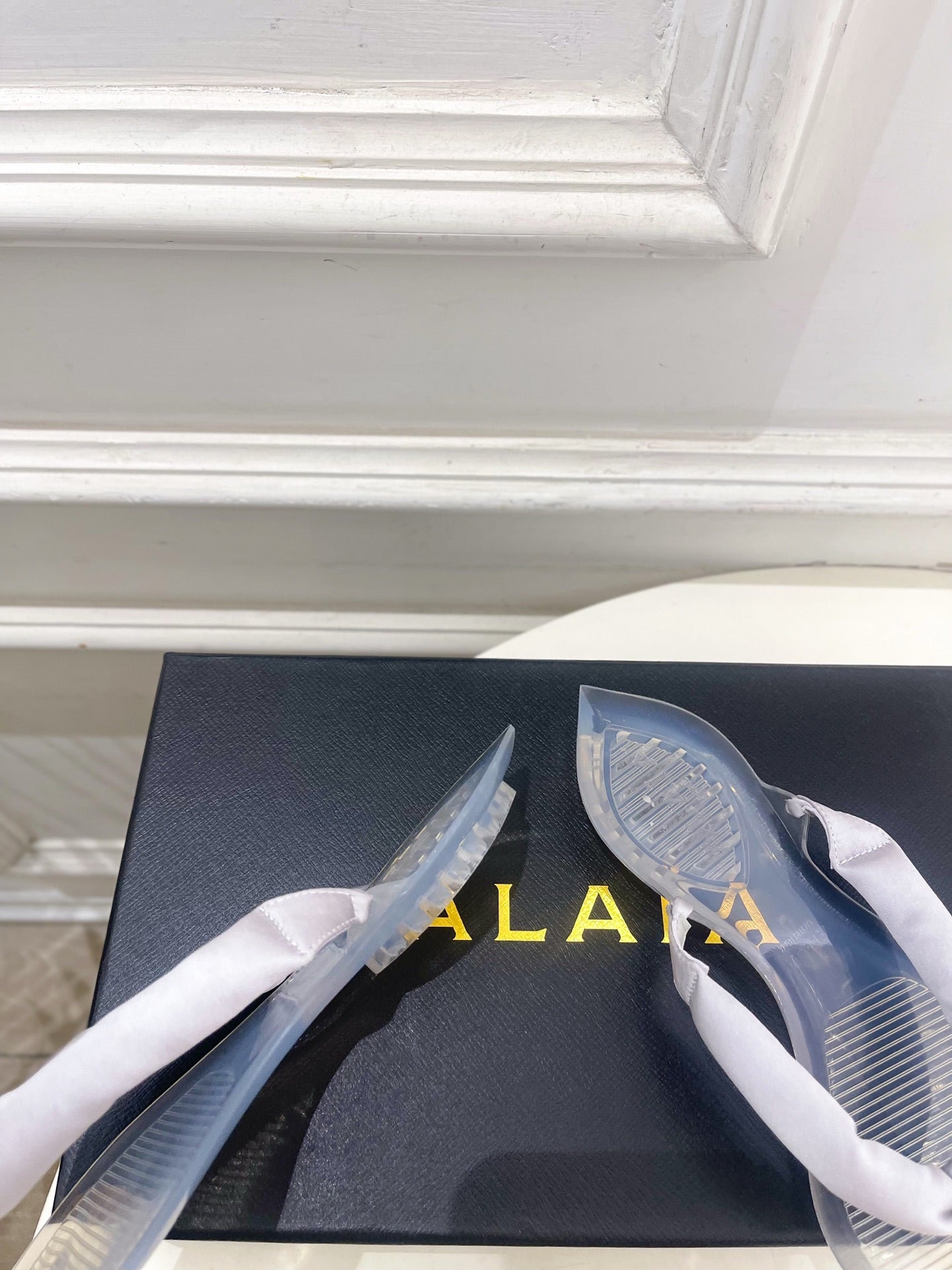 ALAIA 26S THONG SANDALS IN PEARL GREY SATIN AND TRANSPARENT PVC