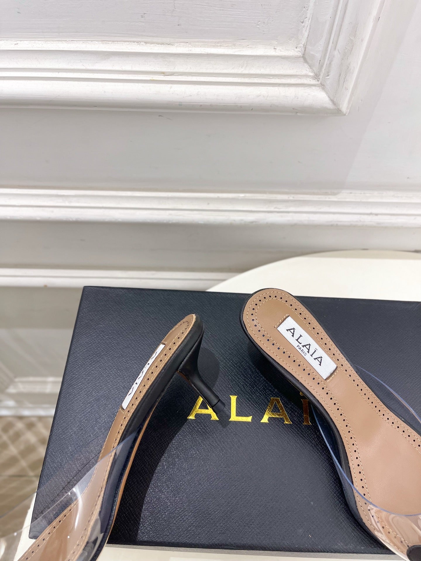 ALAIA 26S MULE HEELS 55 MM IN BLACK LAMBSKIN AND TRANSPARENT PVC