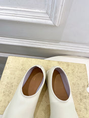 THE ROW 26S SLIP-ON FLATS IN WHITE NAPPA CALFSKIN