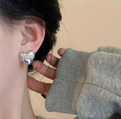 MIUMIU 26S HEART LOGO STUD EARRINGS WITH PEARL DETAILS IN SILVER TONE METAL 630844