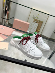 SNEAKER MULES IN WHITE MIX GREEN CALFSKIN WHITE RED LACES